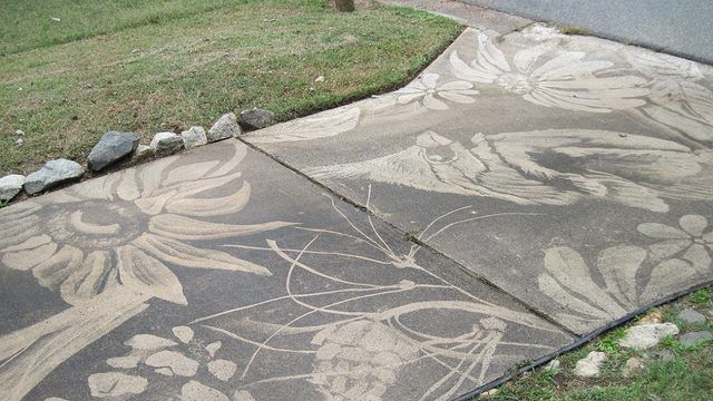 An artist and a pressure washer