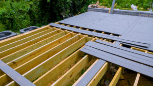 Composite decking laid over the bones of a deck as it is being resurfaced